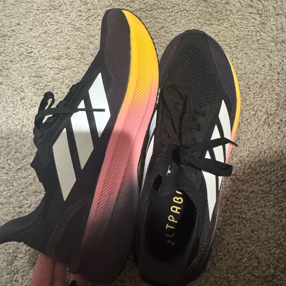 Adidas Black Trainers with Vibrant Sole